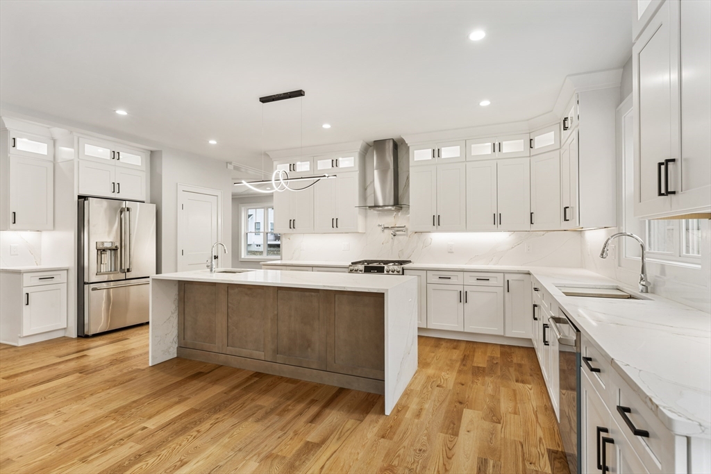 102 Pine Street Norton, MA 02766 - Photo 12 of 41 a large kitchen with stainless steel appliances kitchen island granite countertop a sink and cabinets