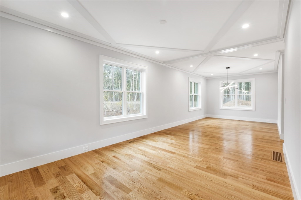 102 Pine Street Norton, MA 02766 - Photo 14 of 41 an empty room with wooden floor and windows