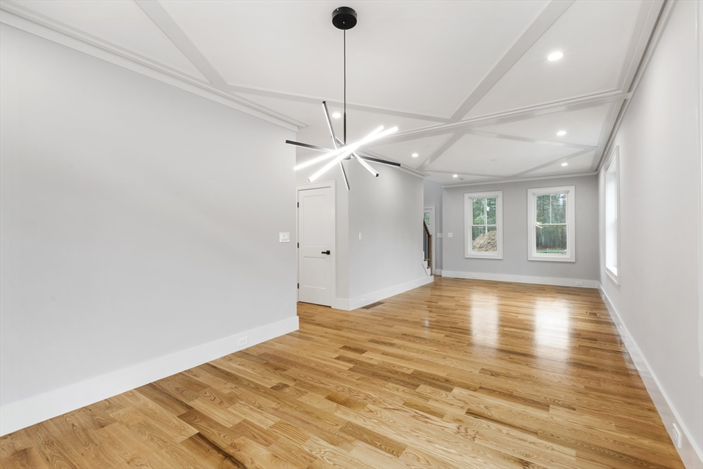 102 Pine Street Norton, MA 02766 - Photo 17 of 41 a view of empty room with wooden floor and fan