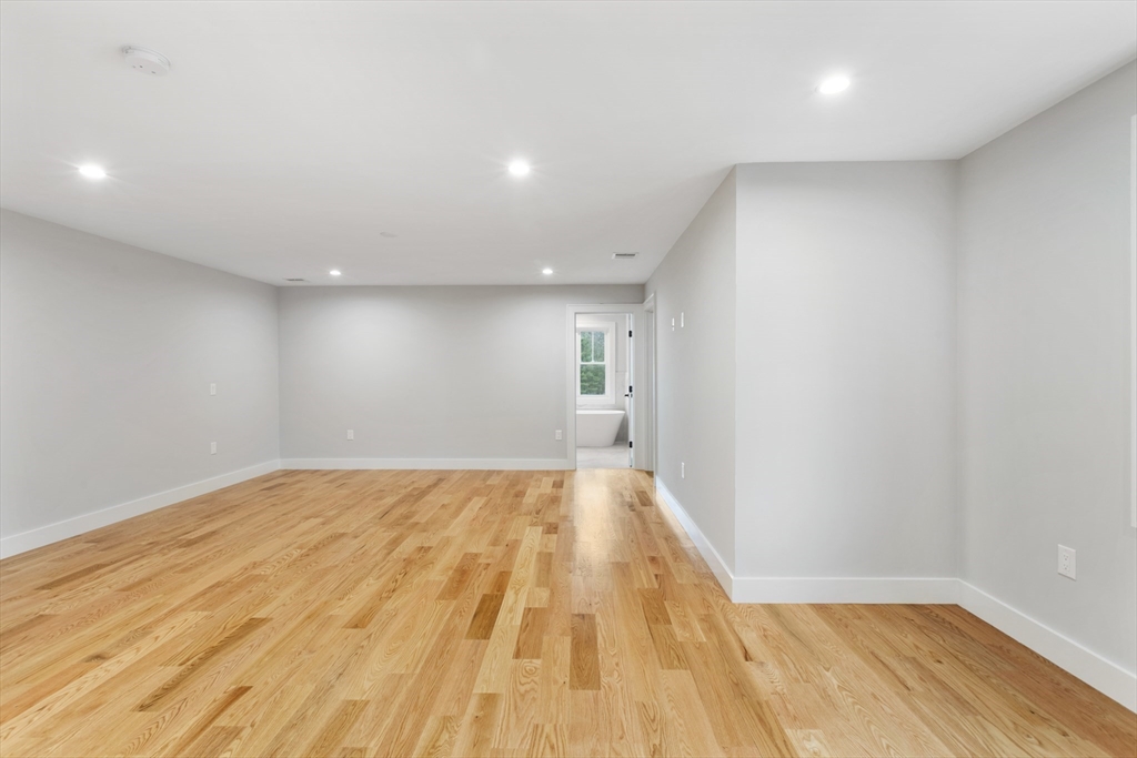 102 Pine Street Norton, MA 02766 - Photo 22 of 41 a view of empty room with wooden floor