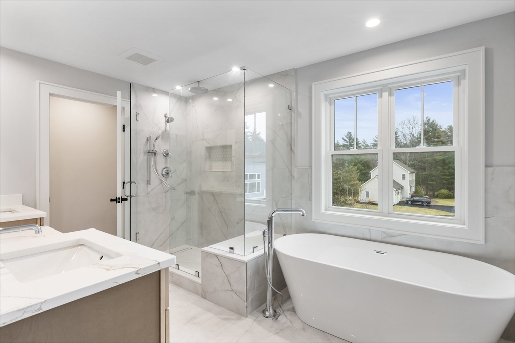 102 Pine Street Norton, MA 02766 - Photo 25 of 41 a bathroom with a tub a sink and a shower