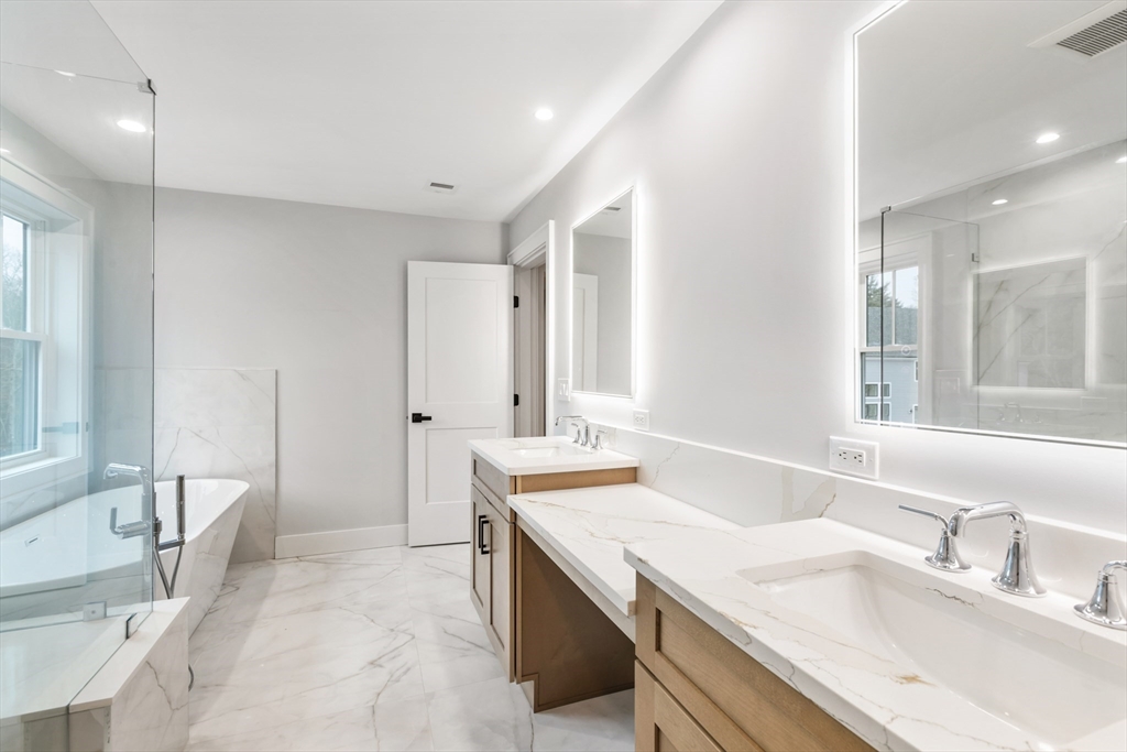 102 Pine Street Norton, MA 02766 - Photo 26 of 41 a bathroom with a sink double vanity granite tub shower and a mirror