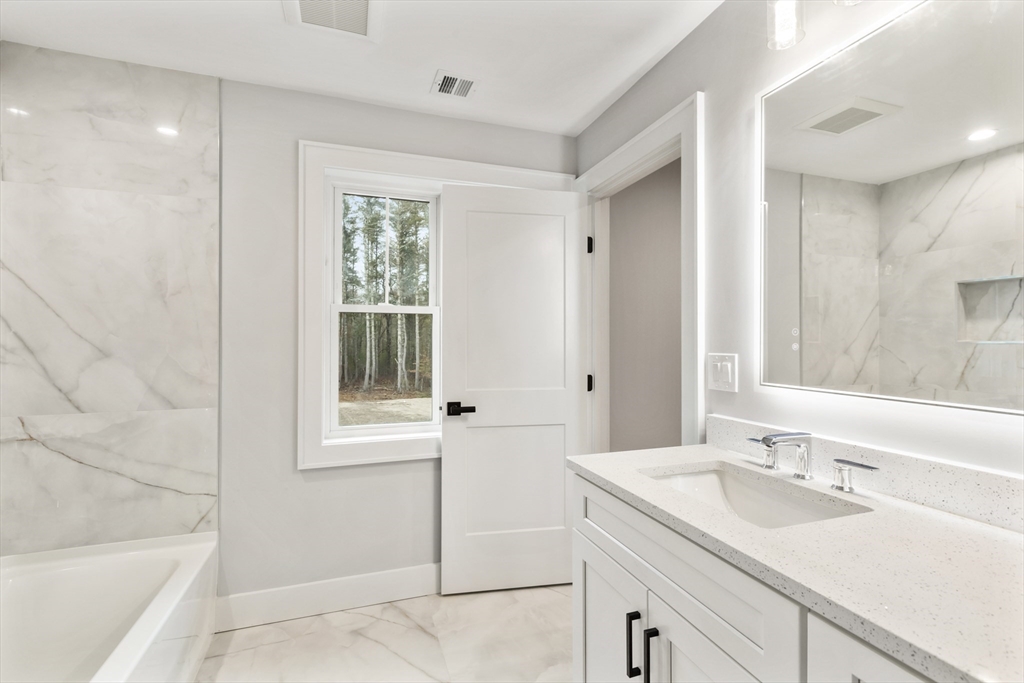 102 Pine Street Norton, MA 02766 - Photo 36 of 41 a bathroom with a sink and a bathtub