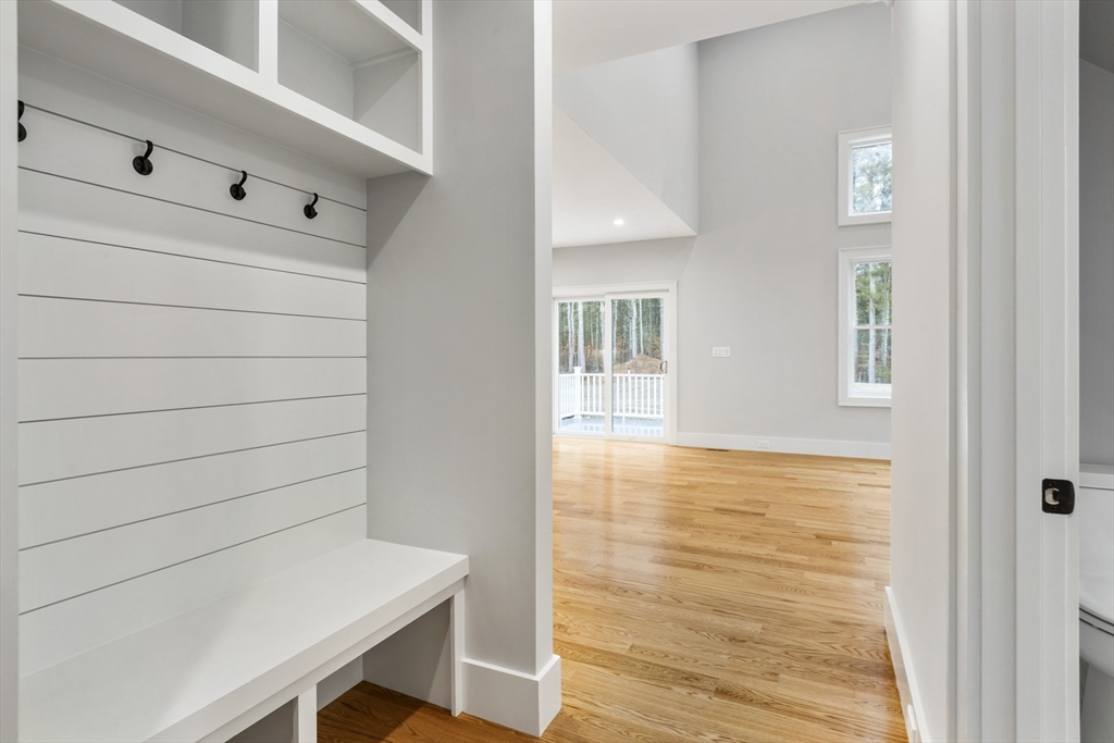 102 Pine Street Norton, MA 02766 - Photo 40 of 41 a view of an empty room with wooden floor and a window