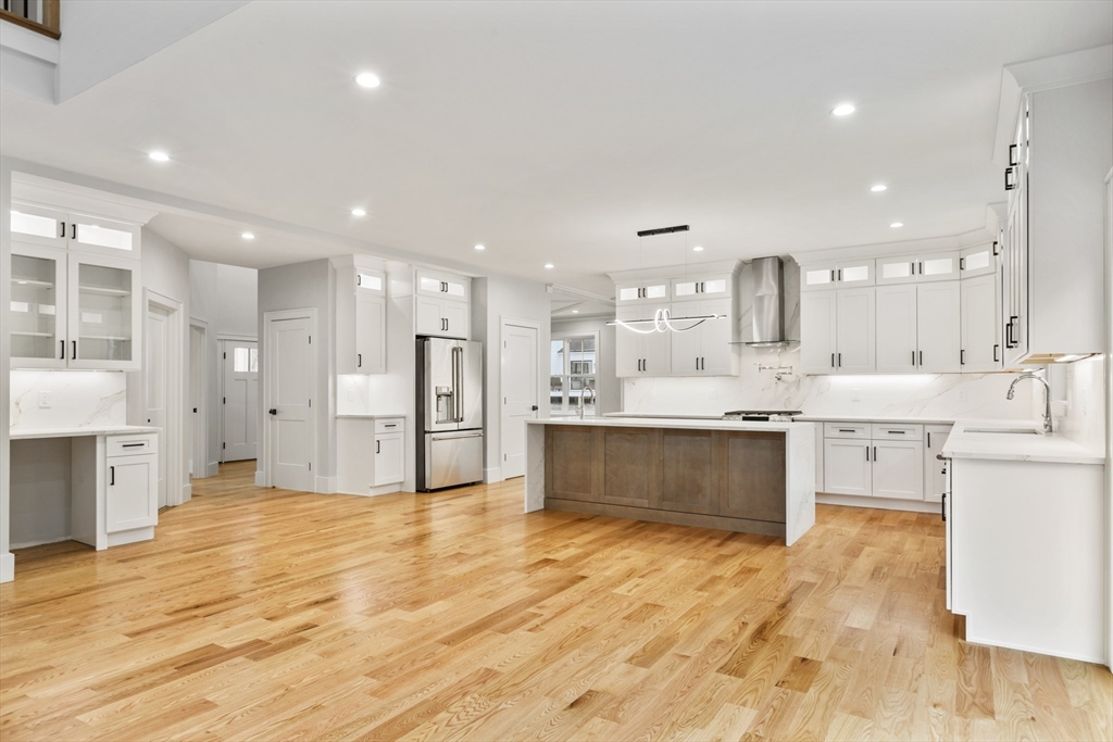 102 Pine Street Norton, MA 02766 - Photo 4 of 41 a large kitchen with stainless steel appliances kitchen island granite countertop a large counter top and a sink