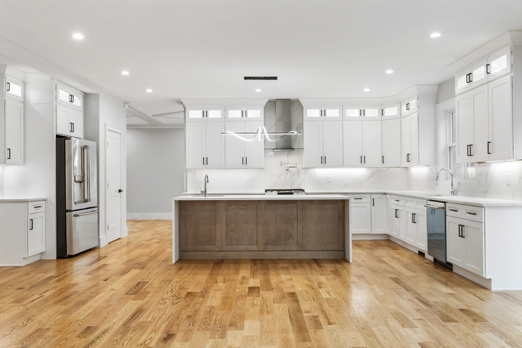 102 Pine Street Norton, MA 02766 - Photo 5 of 41 a large kitchen with kitchen island a sink stainless steel appliances and cabinets
