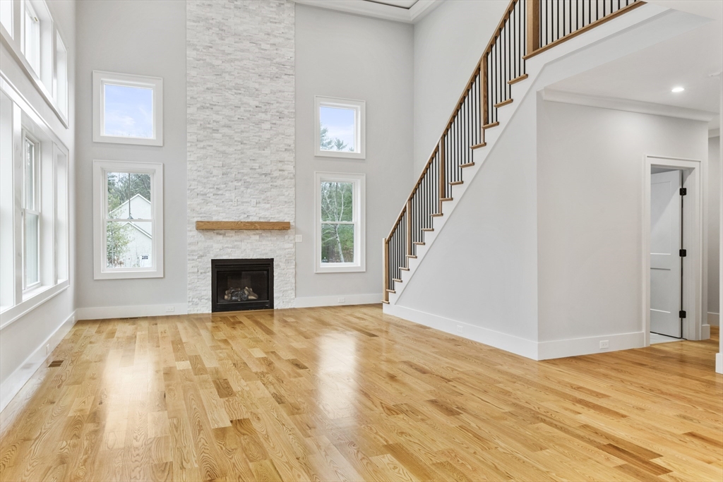 102 Pine Street Norton, MA 02766 - Photo 6 of 41 a view of empty room with wooden floor and fireplace