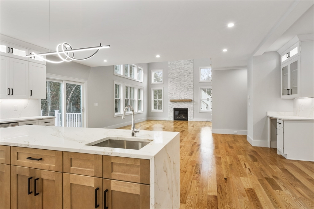 102 Pine Street Norton, MA 02766 - Photo 8 of 41 a large kitchen with kitchen island a sink stainless steel appliances and cabinets