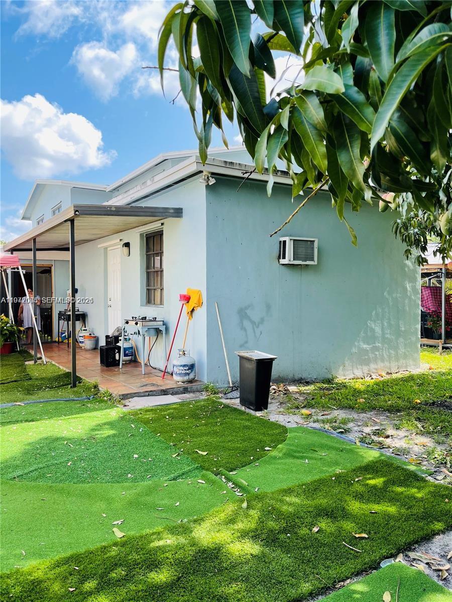 952 East 19th Street Hialeah, FL 33013 - Photo 12 of 13 a view of a house with backyard porch and sitting area