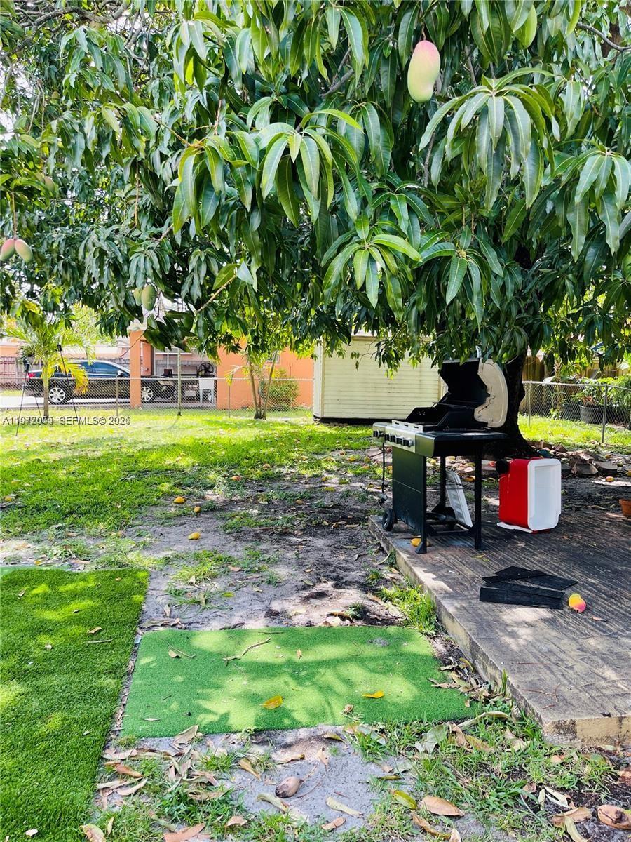 952 East 19th Street Hialeah, FL 33013 - Photo 13 of 13 a view of a backyard with sitting area