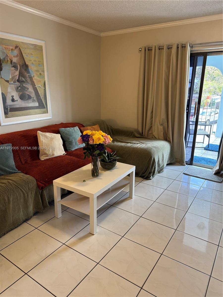952 East 19th Street Hialeah, FL 33013 - Photo 2 of 13 a living room with a couch and a table