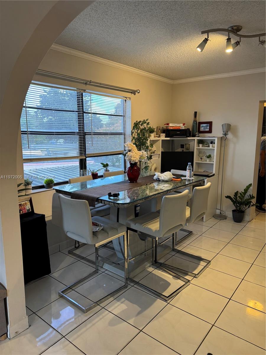 952 East 19th Street Hialeah, FL 33013 - Photo 3 of 13 a view of a workspace with furniture