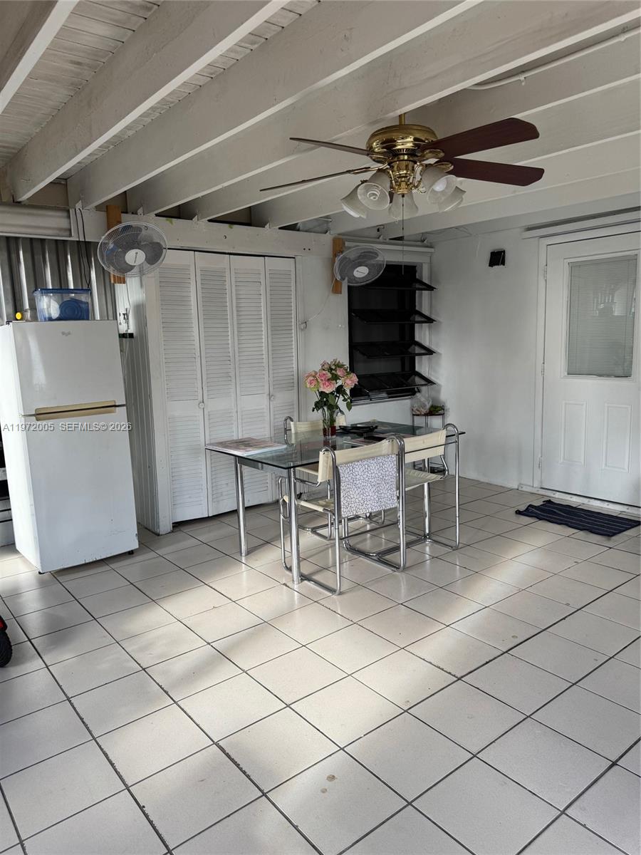 952 East 19th Street Hialeah, FL 33013 - Photo 10 of 13 a dining room with furniture and a fireplace