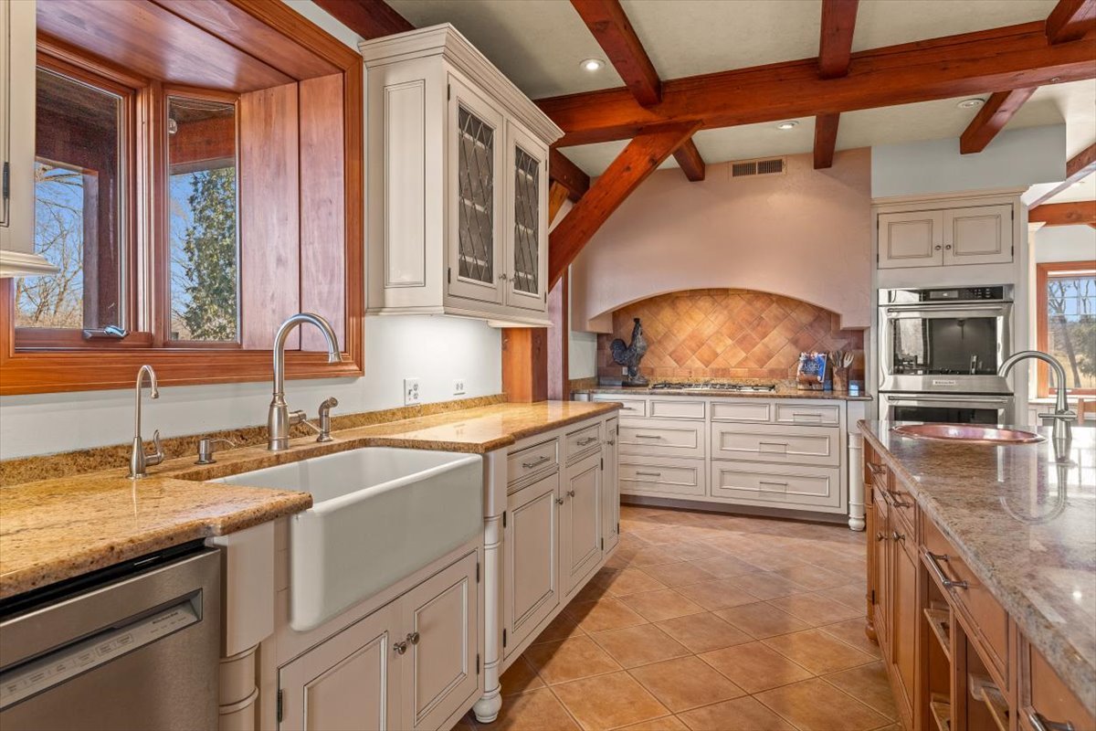 236 Steeplechase Road Barrington Hills, IL 60010 - Photo 17 of 69 a kitchen with granite countertop a sink and a stove