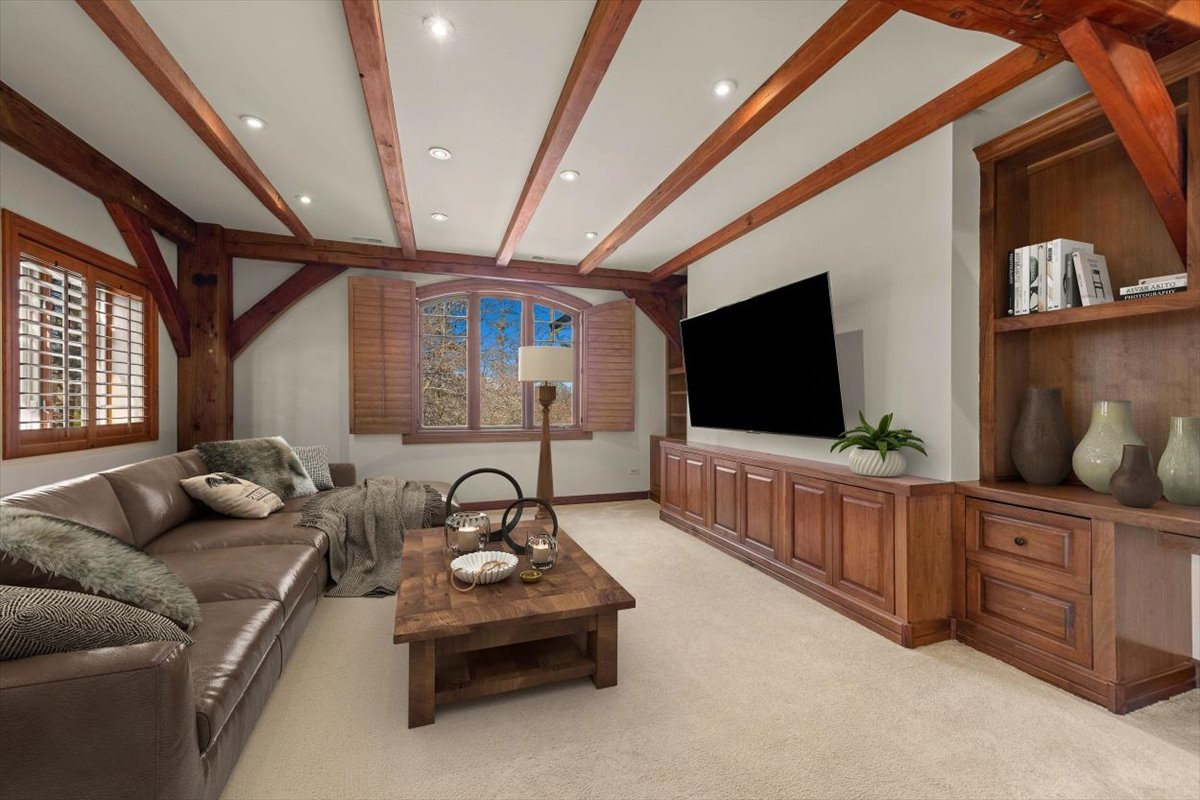 236 Steeplechase Road Barrington Hills, IL 60010 - Photo 26 of 69 a living room with furniture and a flat screen tv