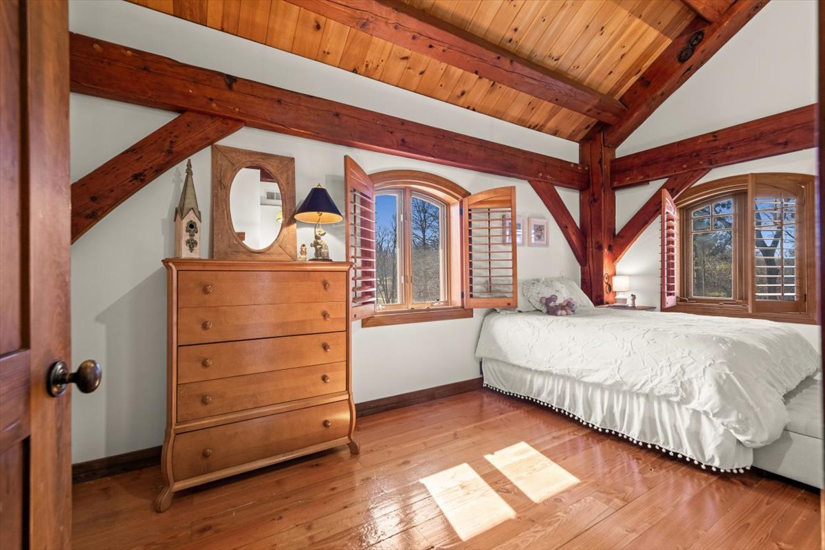 236 Steeplechase Road Barrington Hills, IL 60010 - Photo 39 of 69 a bedroom with a bed and a dresser next to a window