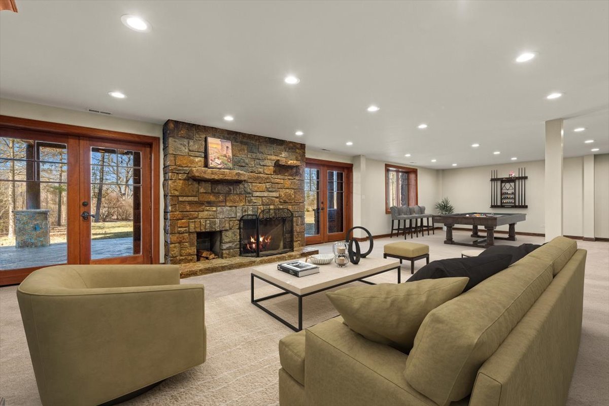 236 Steeplechase Road Barrington Hills, IL 60010 - Photo 44 of 69 a living room with furniture kitchen view and a fireplace