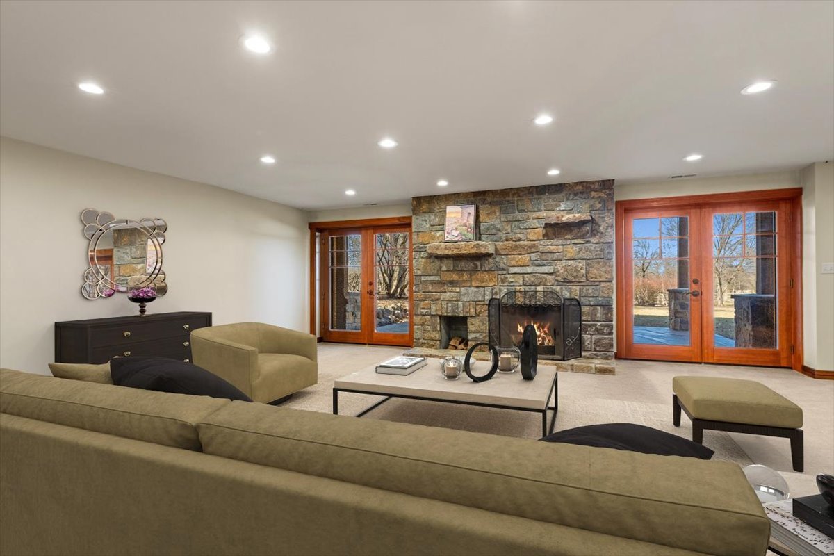 236 Steeplechase Road Barrington Hills, IL 60010 - Photo 45 of 69 a living room with fireplace furniture and a fireplace