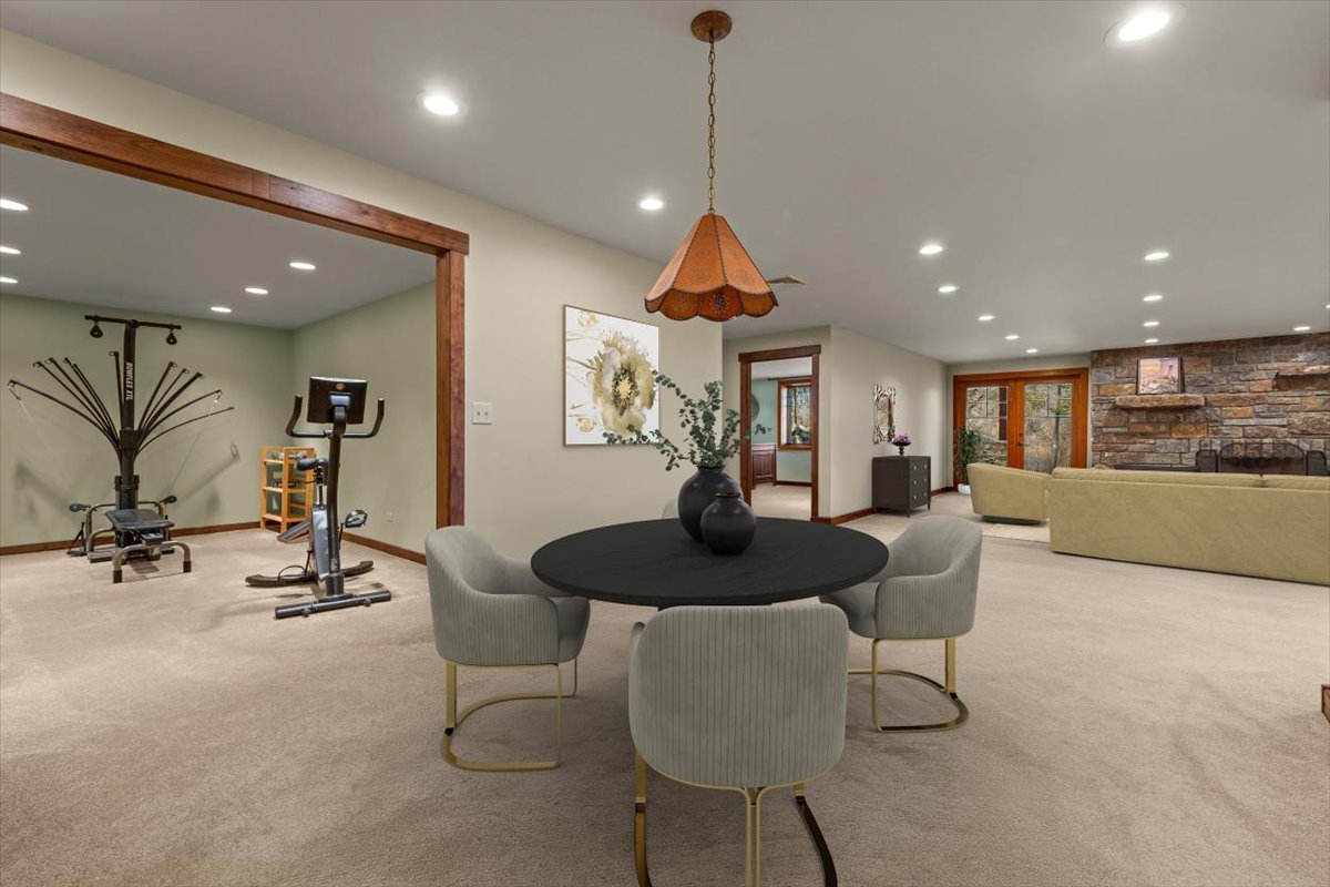 236 Steeplechase Road Barrington Hills, IL 60010 - Photo 49 of 69 a living room with furniture a dining table and a chandelier