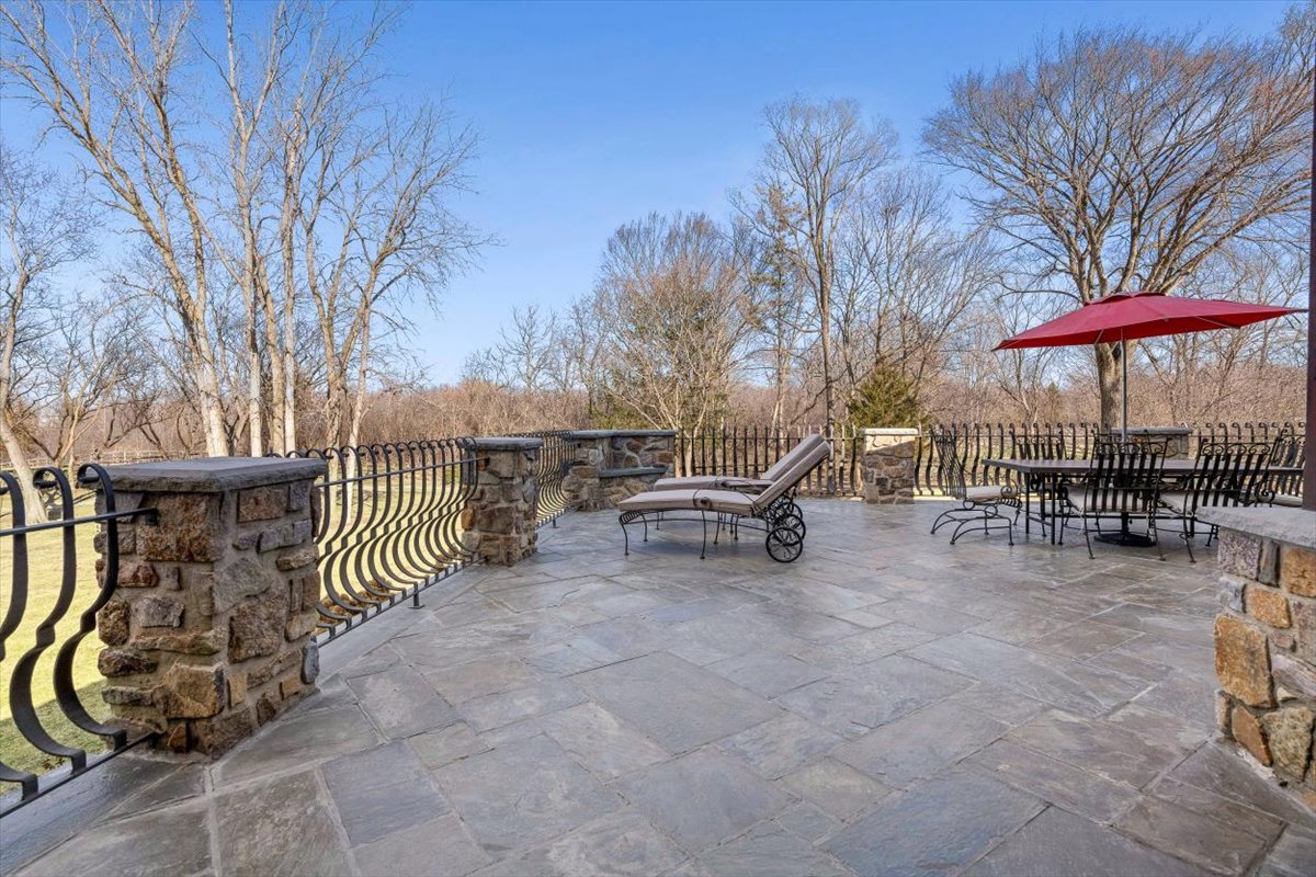 236 Steeplechase Road Barrington Hills, IL 60010 - Photo 55 of 69 a view of a patio with a table and chairs