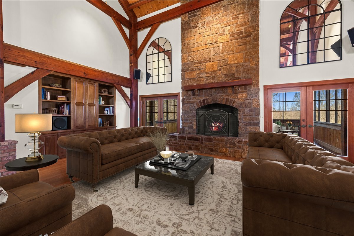 236 Steeplechase Road Barrington Hills, IL 60010 - Photo 10 of 69 a living room with furniture a fireplace and a floor to ceiling window
