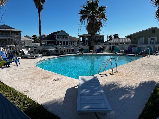 2290 North Fulton Beach Road, Unit B317 Rockport, TX 78382 - Photo 38 of 40 a view of a swimming pool with a deck