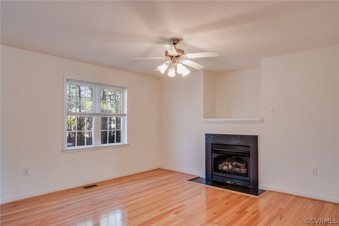 3931 Hazelnut Branch Road Midlothian, VA 23112 - Photo 16 of 34 a living room with furniture and a fireplace