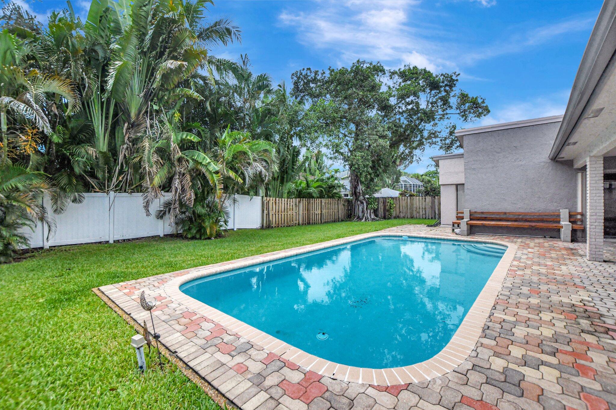 1398 Southwest 17th Street Boca Raton, FL 33486 - Photo 31 of 41 a view of a swimming pool with a yard and sitting area