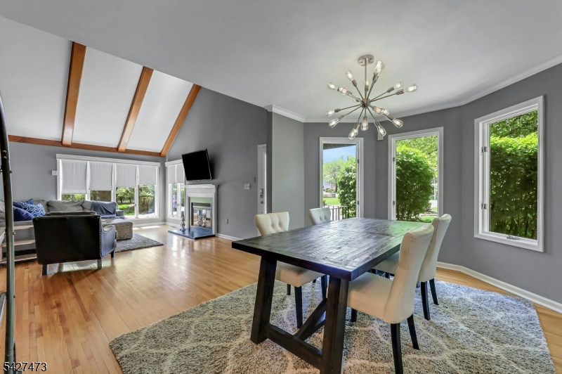 100 Easedale Road, Unit 100 Wayne, NJ 07470 - Photo 14 of 43 a view of a dining room with furniture window and wooden floor