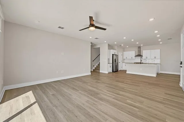 a kitchen with granite countertop stainless steel appliances and sink
