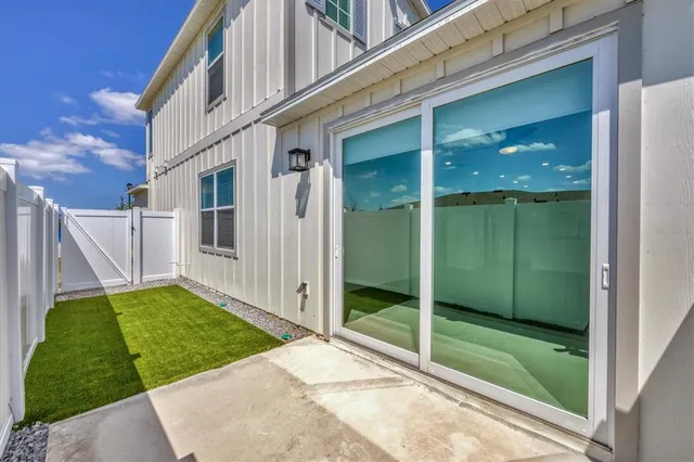 a front view of a residential apartment building with a yard