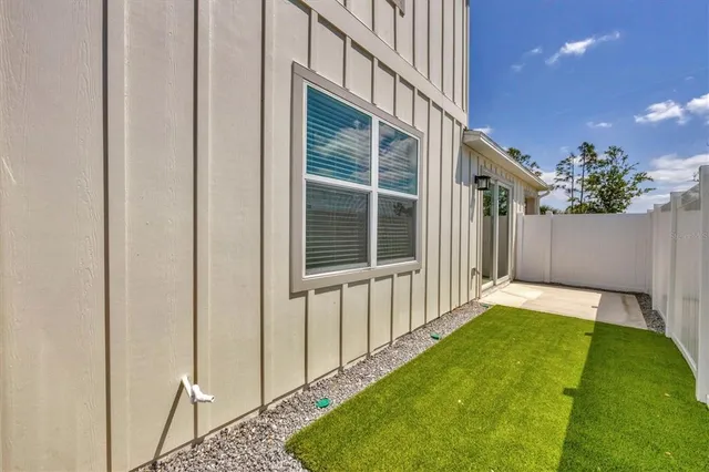 a view of living room filled with furniture and a potted plant
