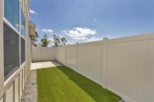 a view of street with potted plants