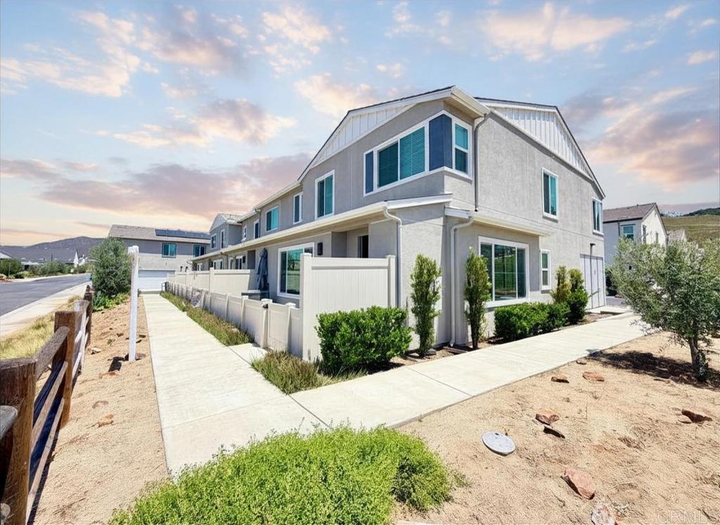 35104 Crop Place Fallbrook, CA 92028 - Photo 8 of 13 a front view of a house with a yard