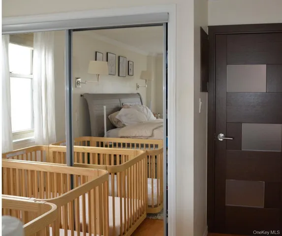a view of a hallway with windows and stairs