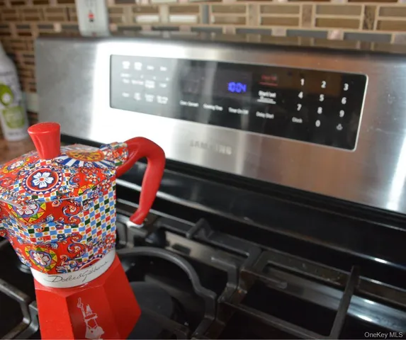 a room with a baby crib and a couch