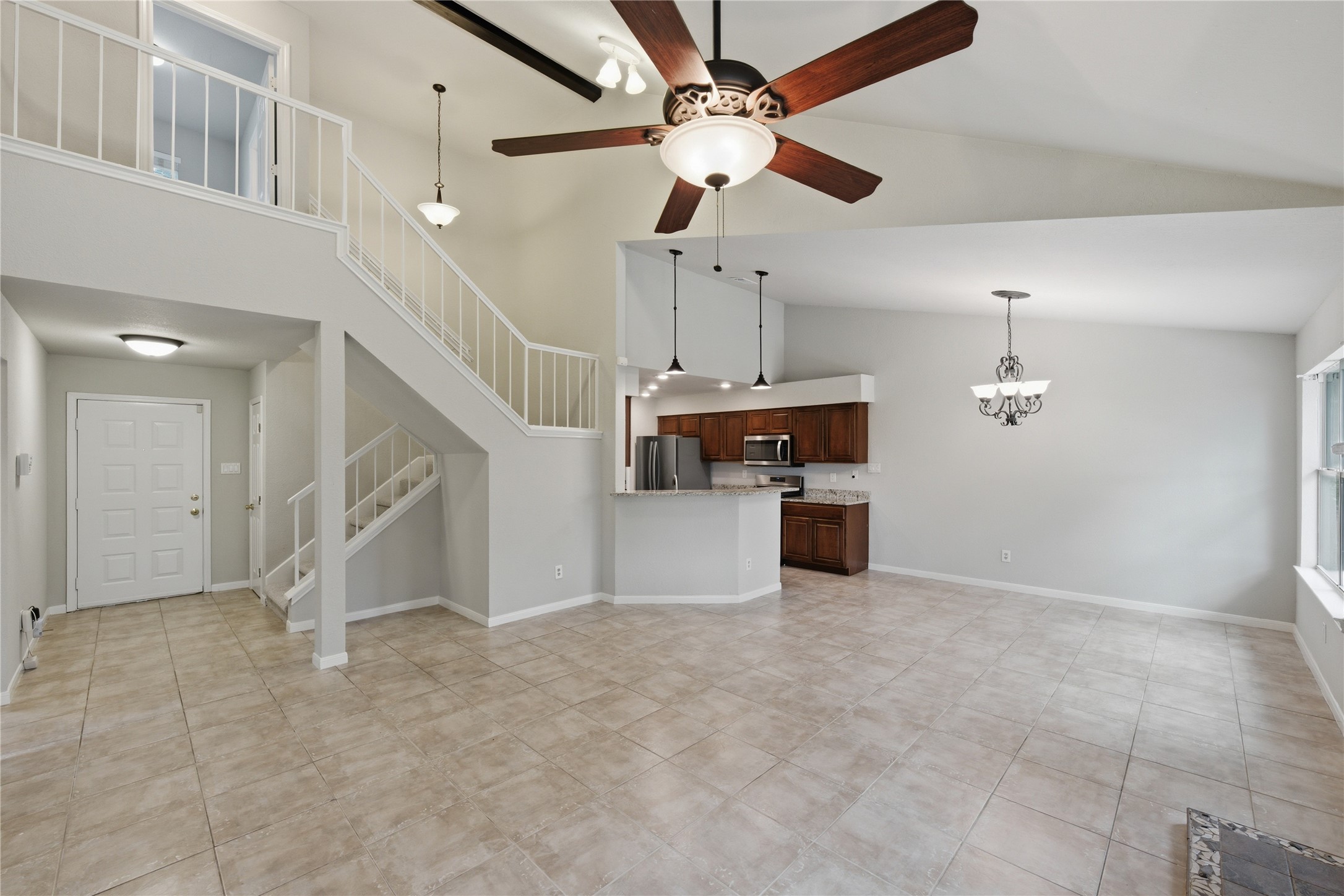 1317 Mimosa Pass Cedar Park, TX 78613 - Photo 20 of 20 a view of a kitchen with furniture and a ceiling fan