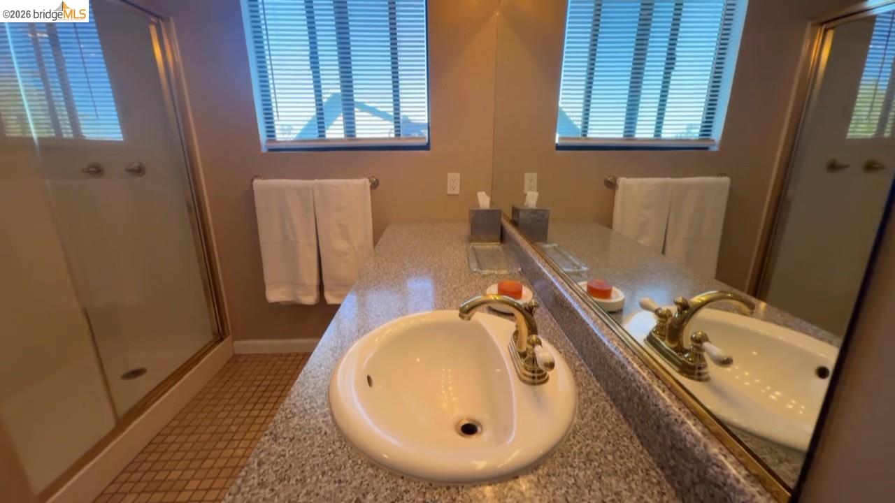 3777 Willow Road Bethel Island, CA 94511 - Photo 14 of 34 Bathroom with vanity, a stall shower, and light tile patterned flooring