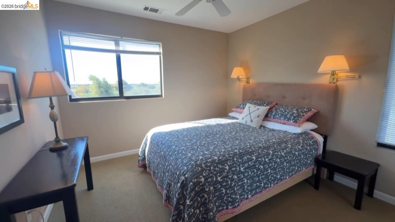 3777 Willow Road Bethel Island, CA 94511 - Photo 16 of 34 Bedroom featuring a ceiling fan and carpet floors