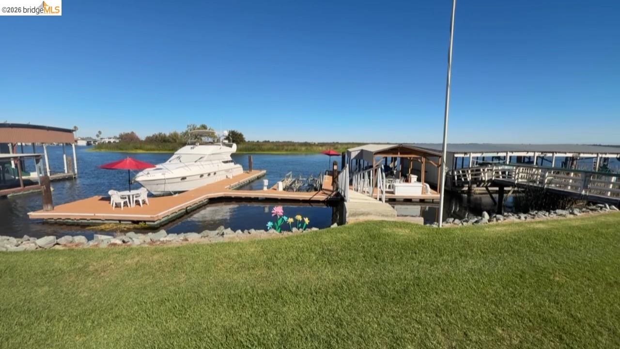 3777 Willow Road Bethel Island, CA 94511 - Photo 8 of 34 Dock area featuring a water view and a yard