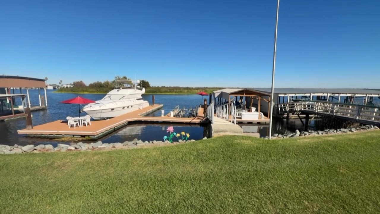3777 Willow Road Bethel Island, CA 94511 - Photo 8 of 32 Dock area featuring a water view and a yard