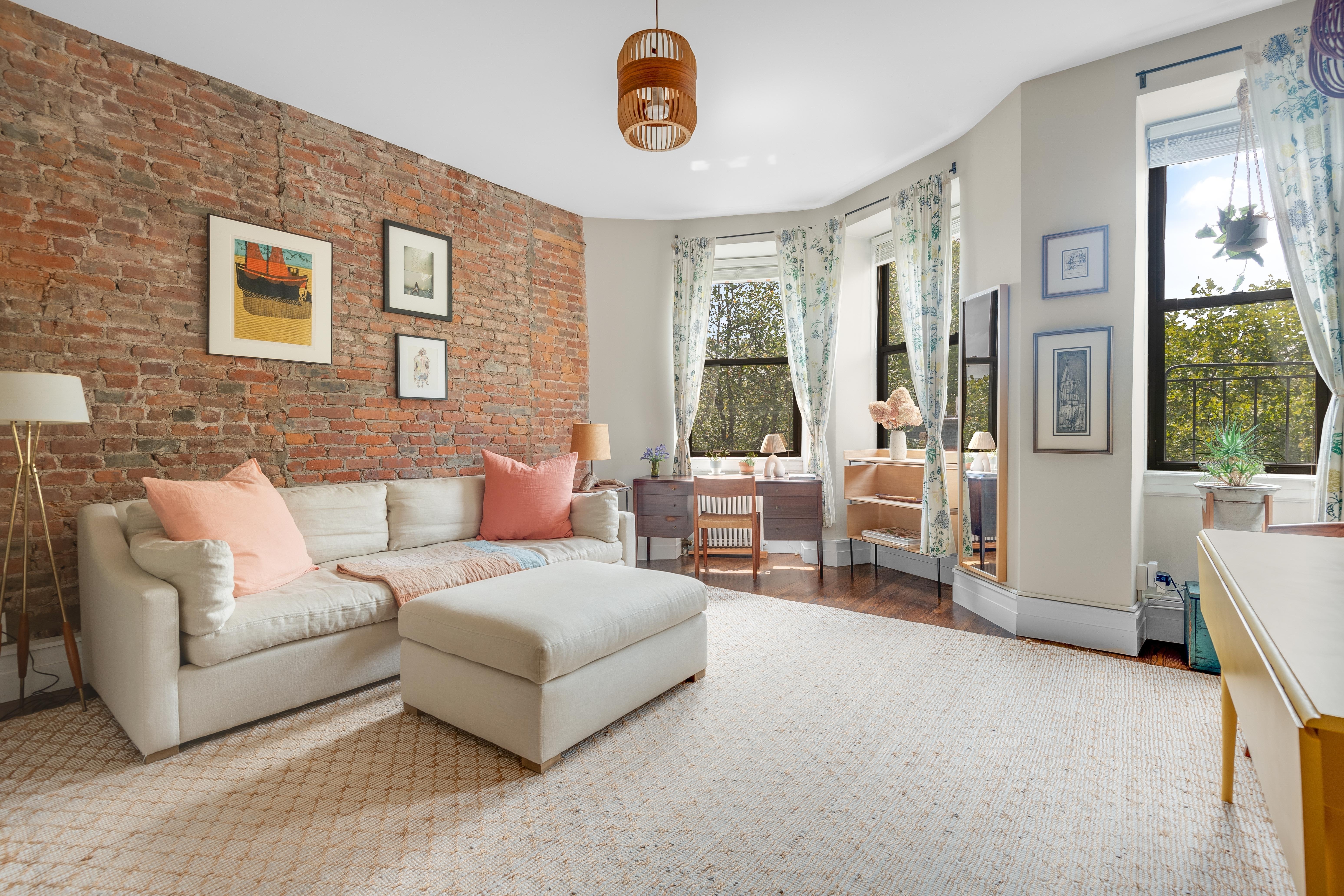 175 Amity Street, Unit D3 Brooklyn, NY 11201 - Photo 1 of 10 a living room with furniture and a table