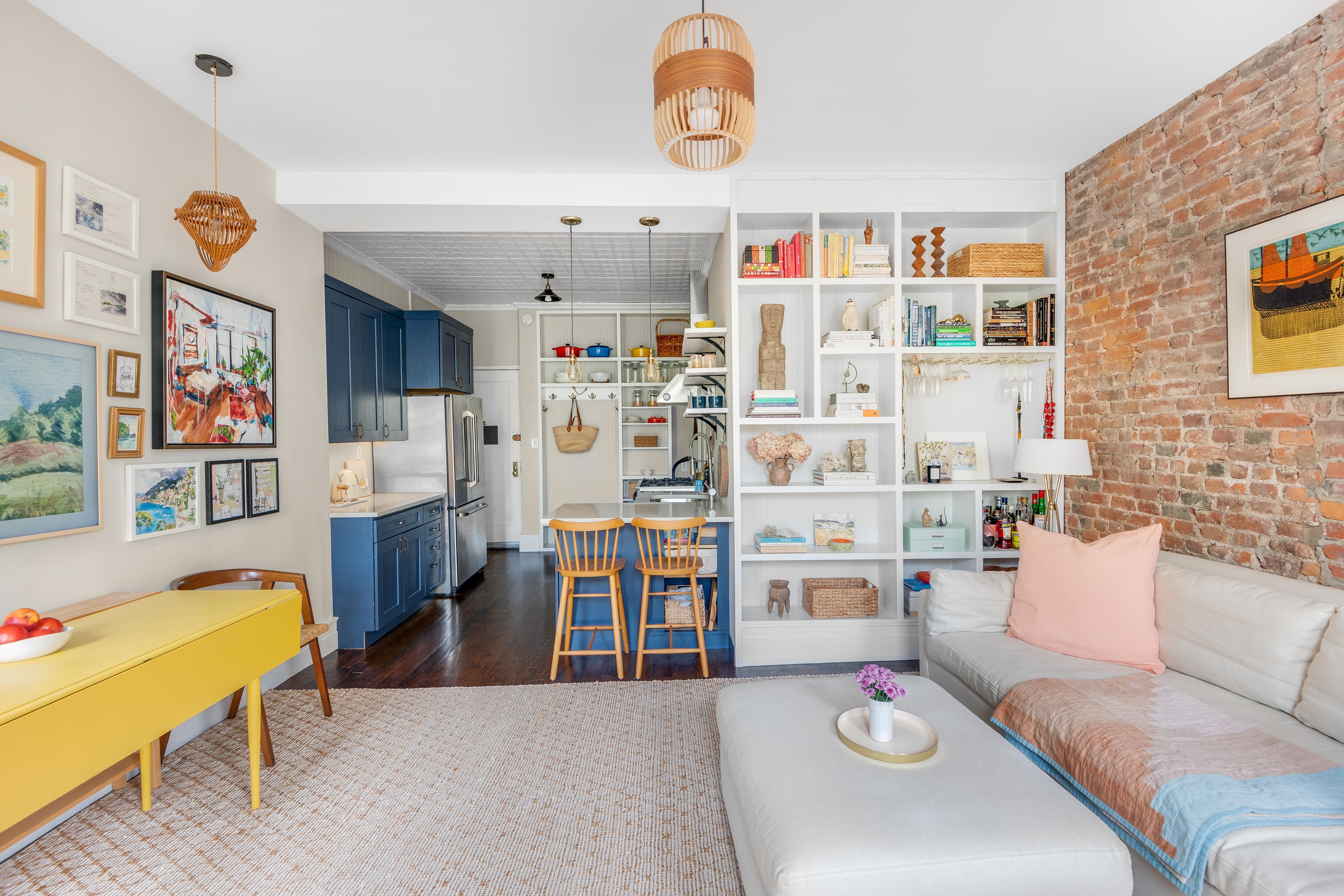 175 Amity Street, Unit D3 Brooklyn, NY 11201 - Photo 3 of 10 a living room with furniture cabinets and a kitchen floor