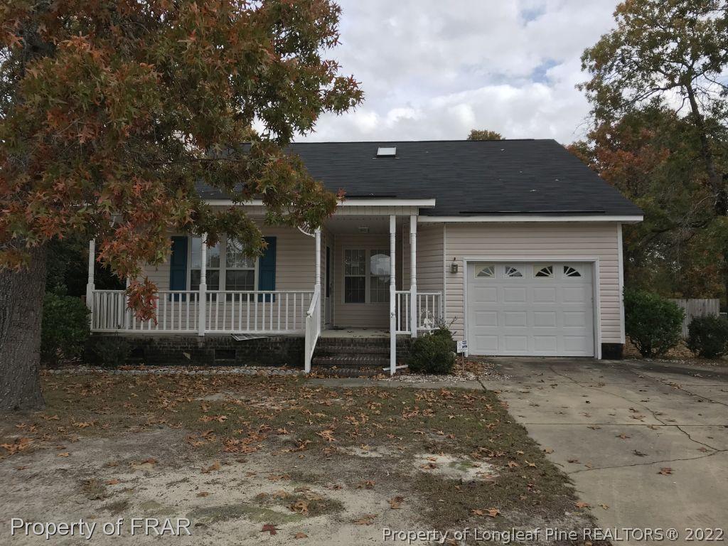 401 Kernstown Road Raeford, NC 28376 - Photo 1 of 10 a front view of a house with a garden