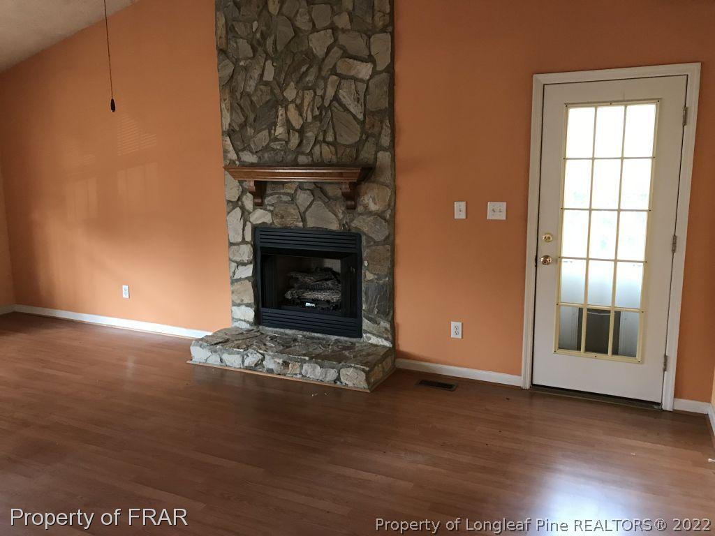 401 Kernstown Road Raeford, NC 28376 - Photo 4 of 10 a living room with a fireplace