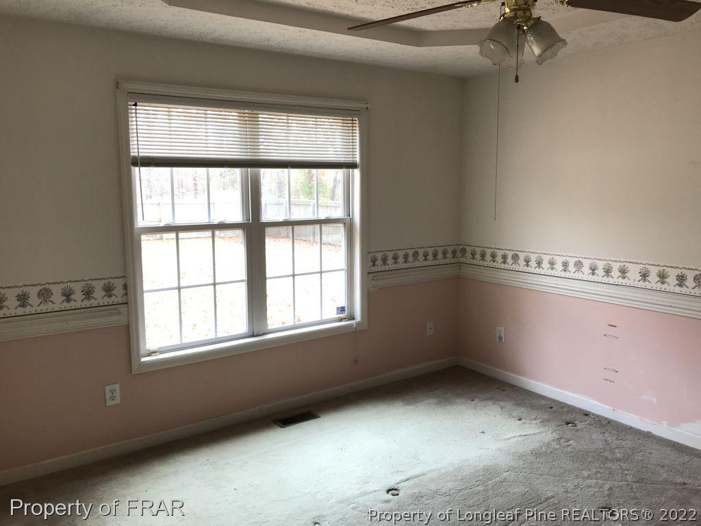 401 Kernstown Road Raeford, NC 28376 - Photo 8 of 10 a view of an empty room with a window