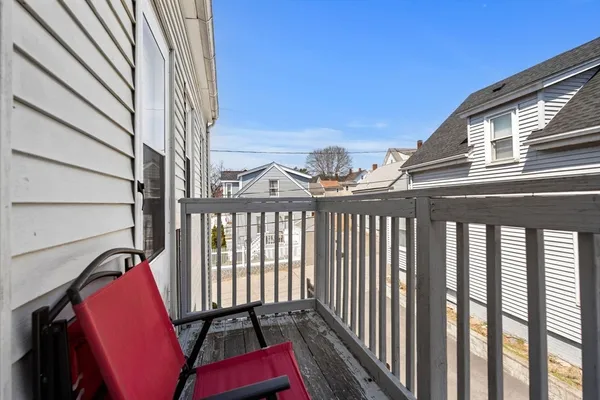 a view of a balcony with chair