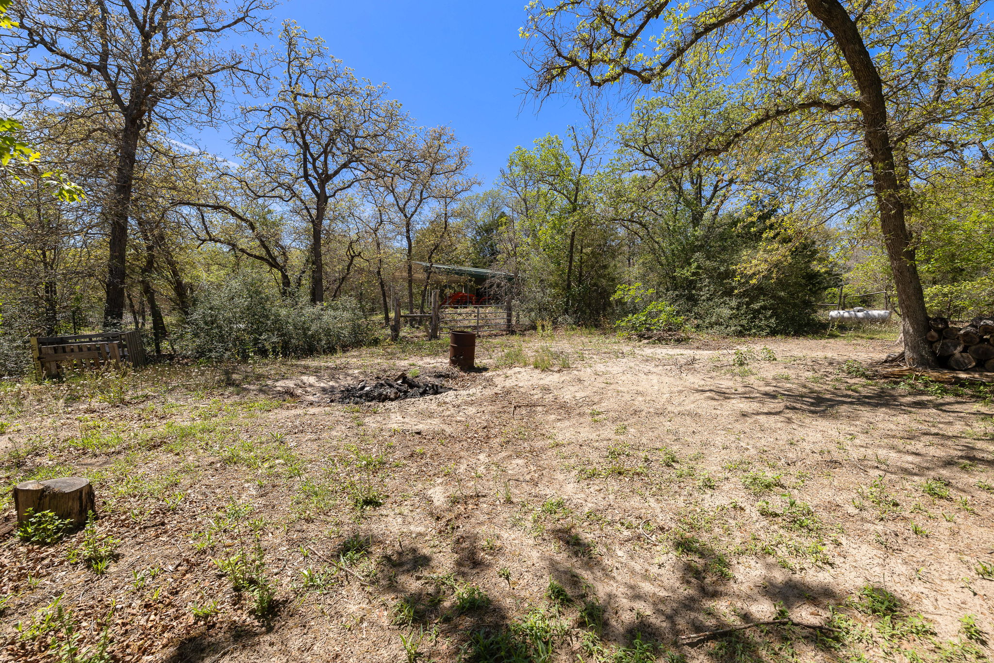 541 Hidden Oaks Drive Elgin, TX 78621 - Photo 32 of 40 Fire pit area behind the home