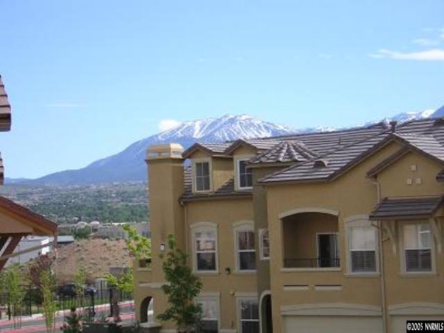 9050 Double R Bvld, Unit 1221 Reno, NV 89521 - Photo 8 of 8 a front view of a house with a mountain