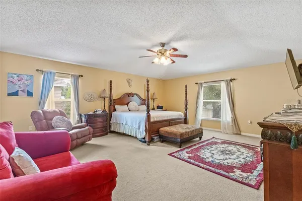 a bedroom with furniture and a window